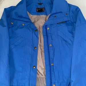 bright blue wilderness experience rain jacket